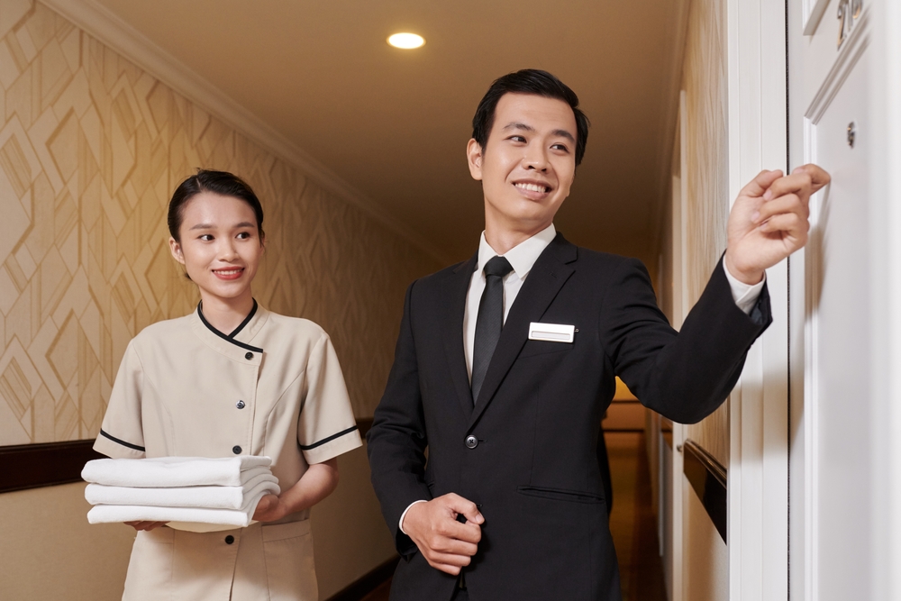 Hotel manager knocking on the door.