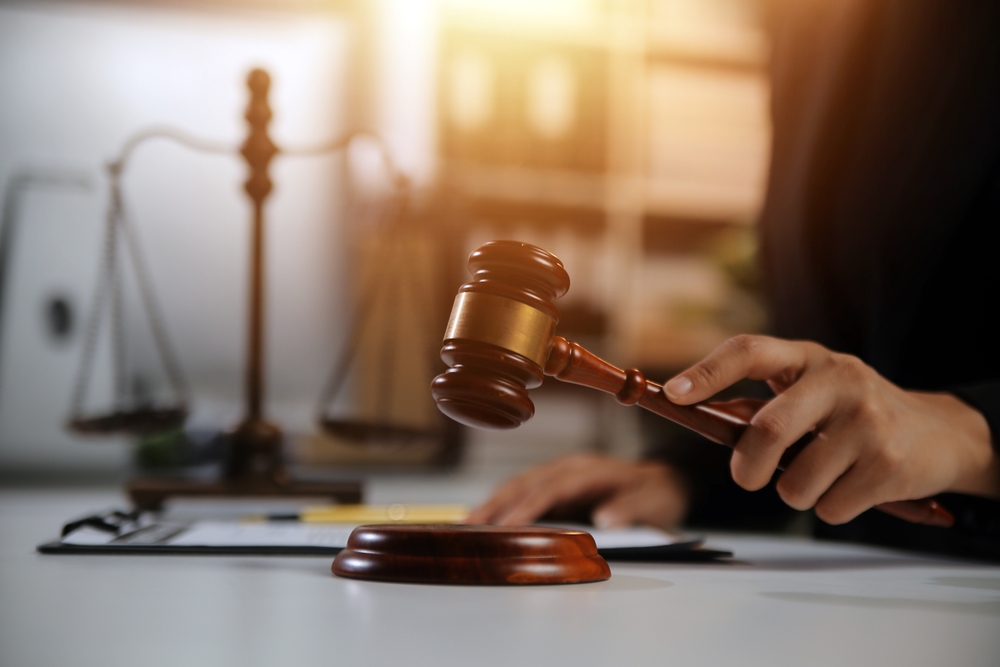A judge banging his gavel.