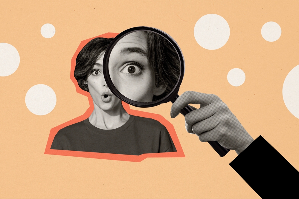 Woman looking surprised with a microscope over her eye suggesting judgement, surprise, intrigue.