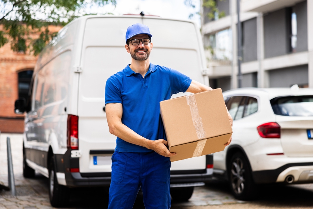 Delivery driver holding a box