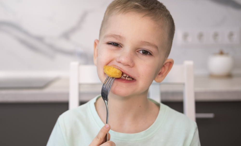 Little boy having a snack.