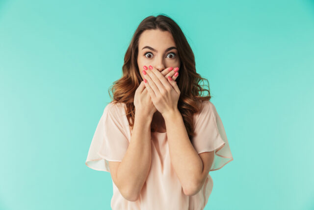 Young woman looking shocked.