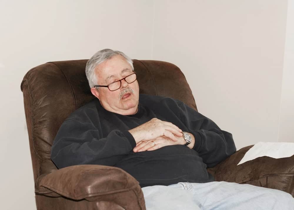 Senior man asleep in his chair. 