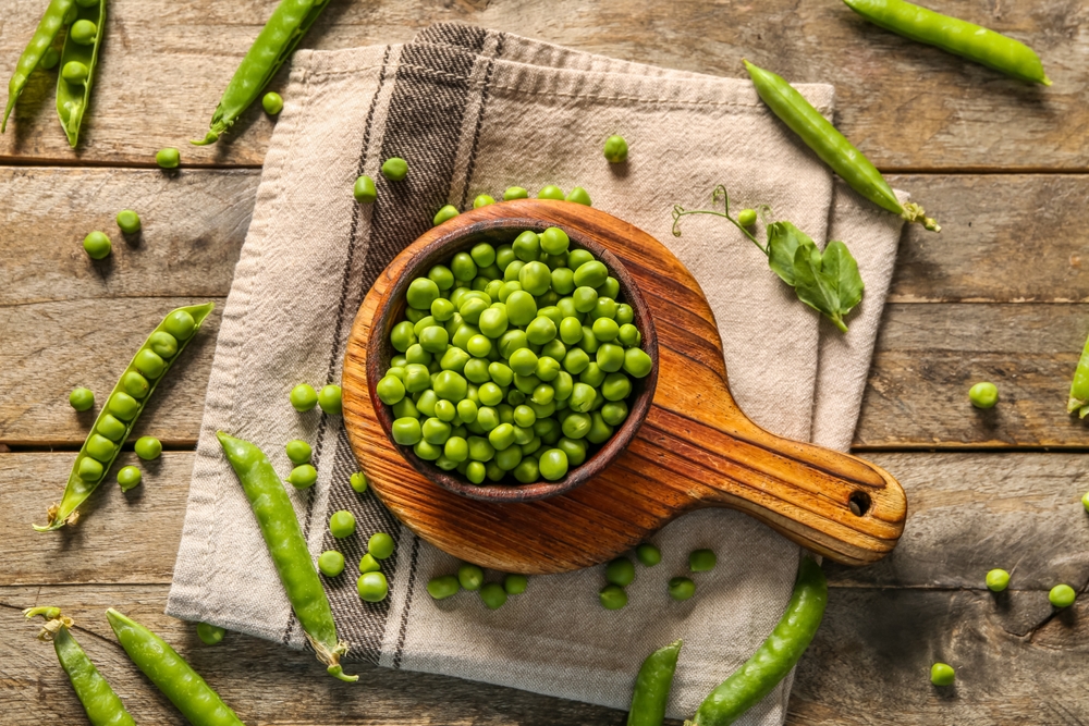 A bowl of green peas.