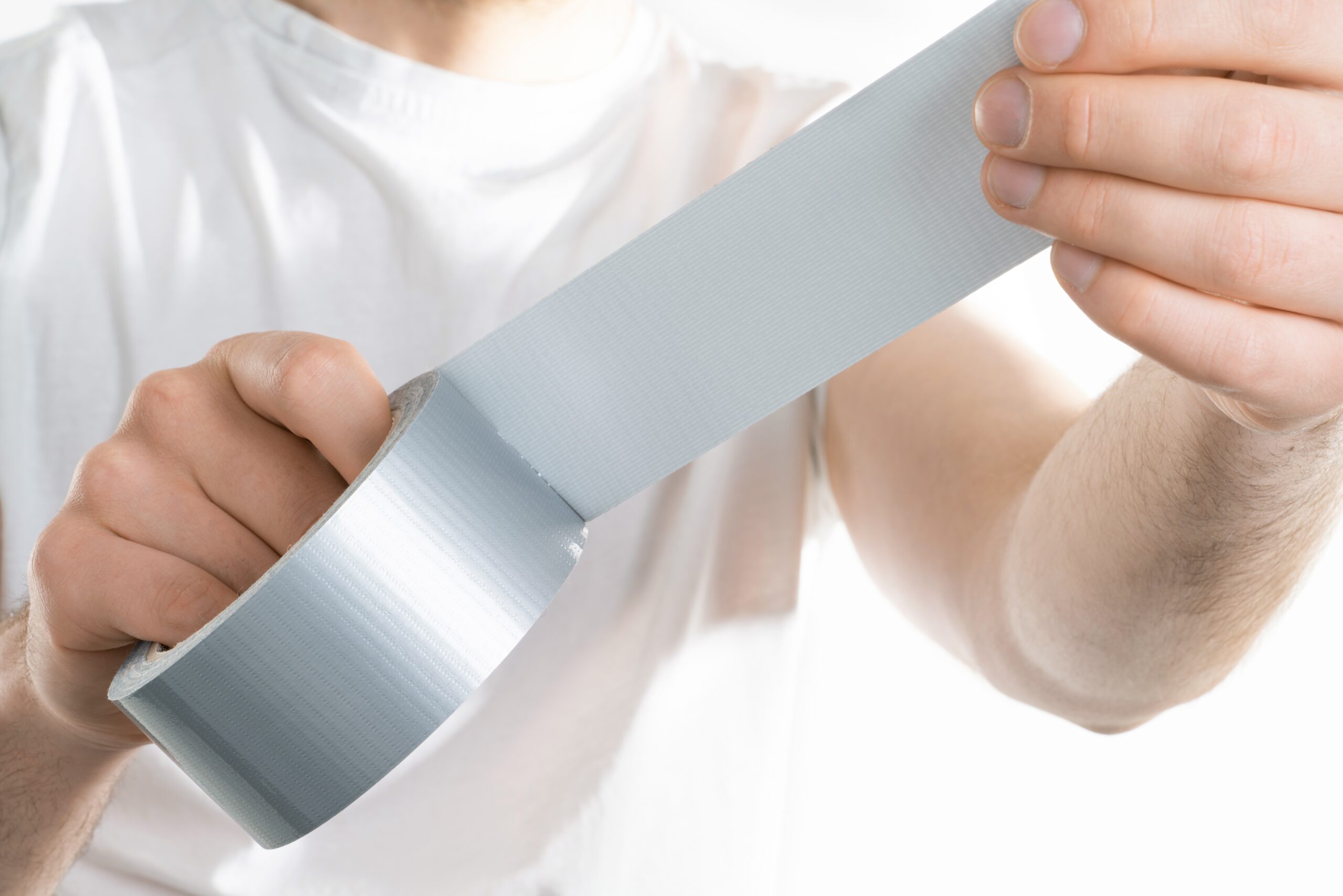 Man holding duct tape.