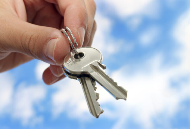 Woman holding keys.