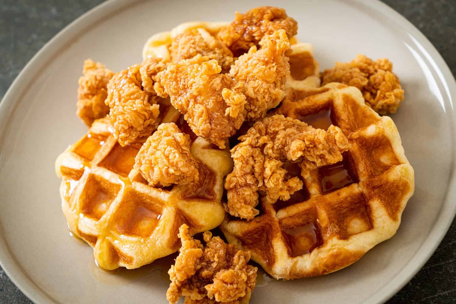 Fried chicken and waffles on a plate.