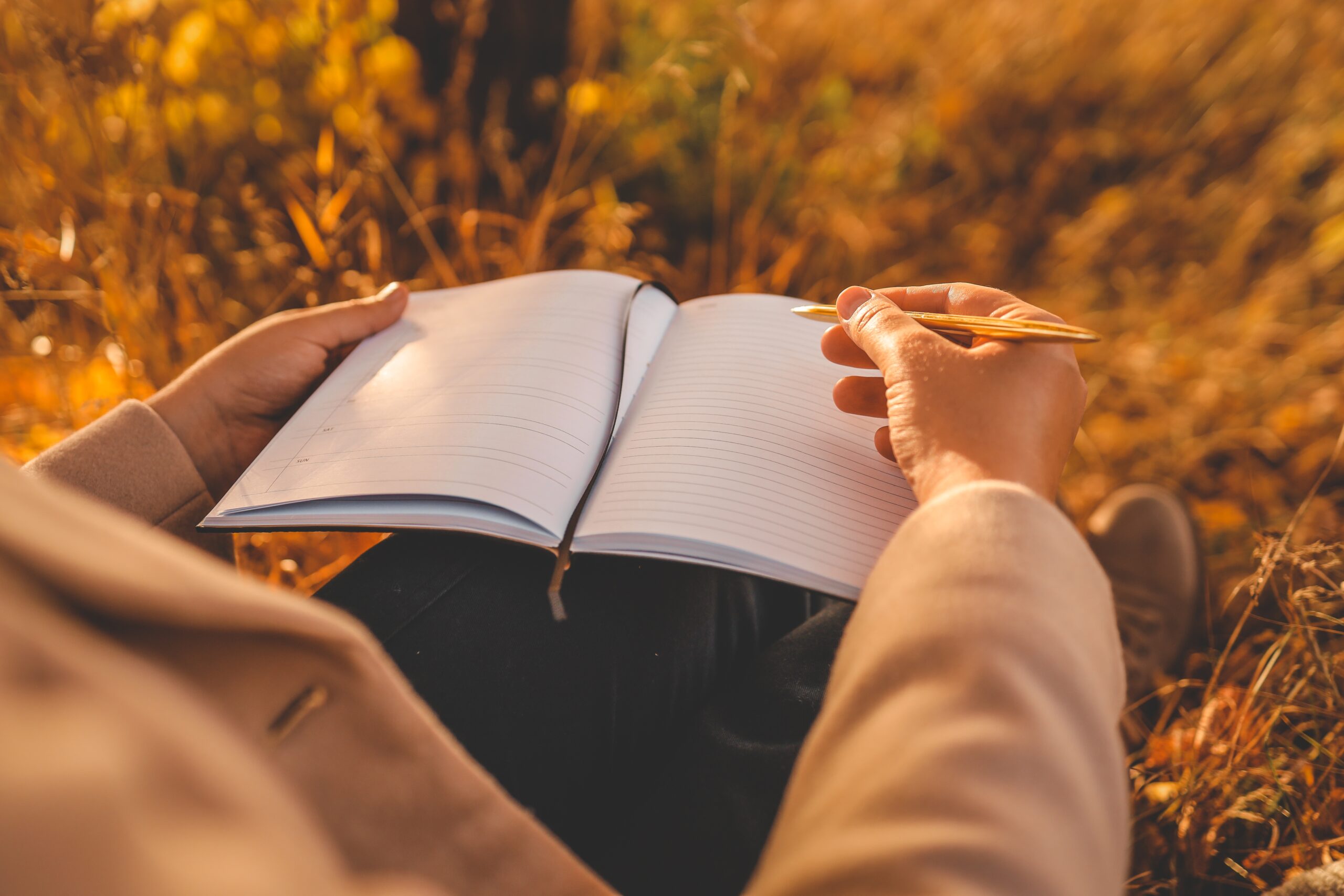 Woman writing in a journal.