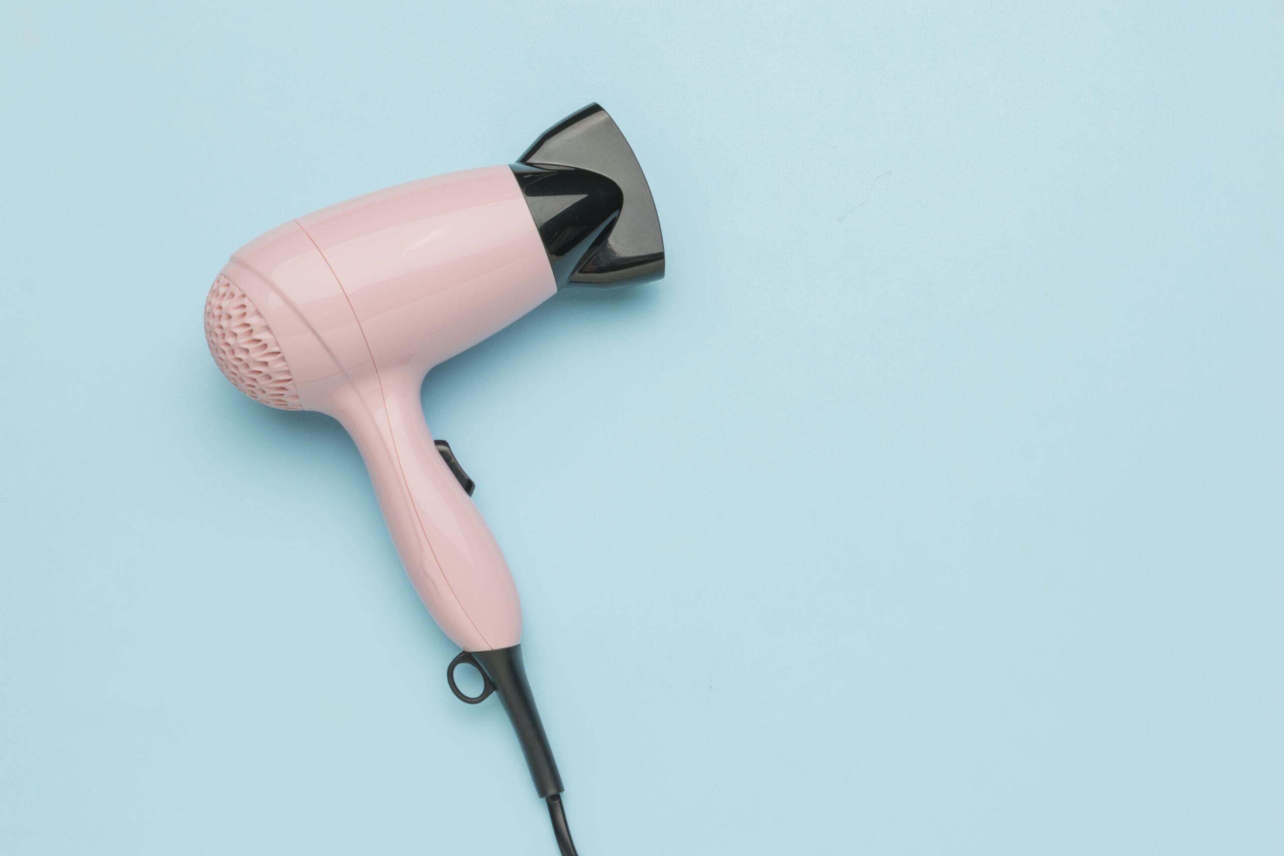 A pink hair dryer.