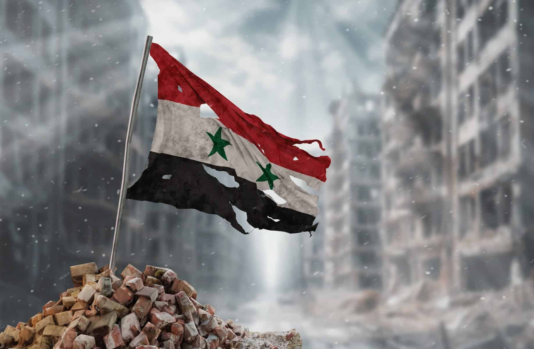 A tattered Syriann flag.