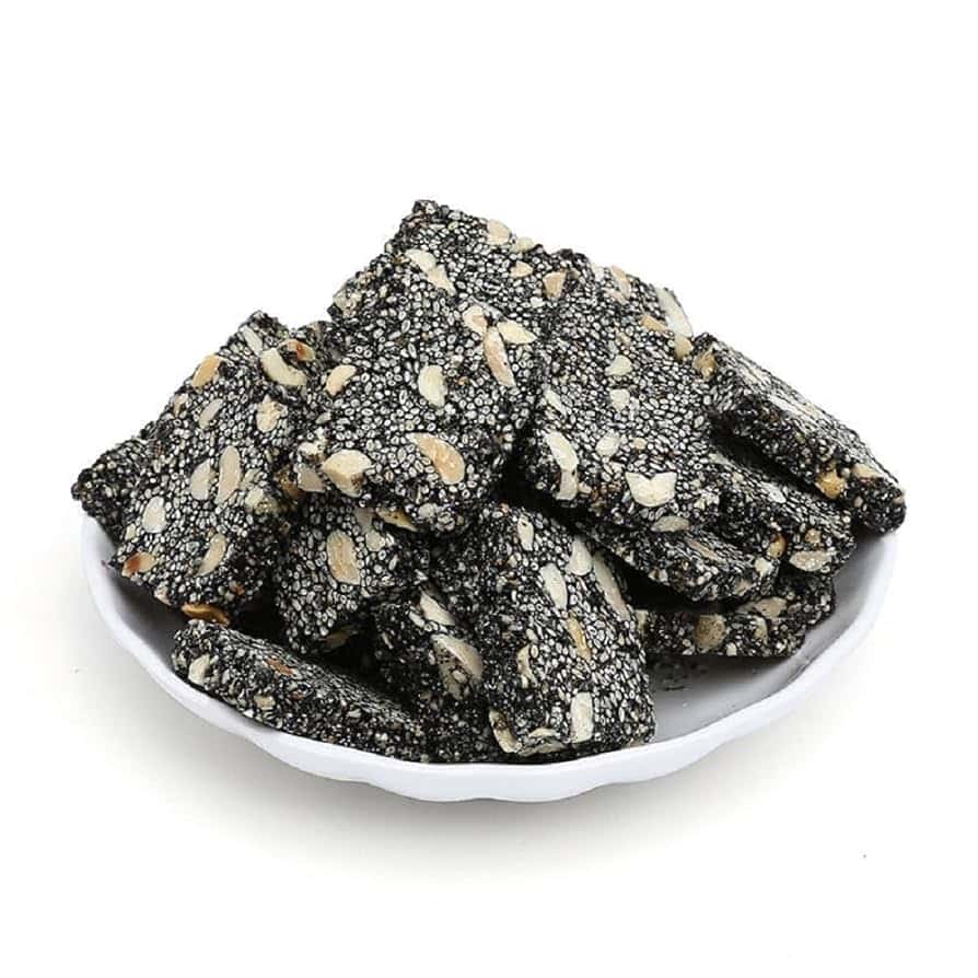 Black sesame candy on a plate.