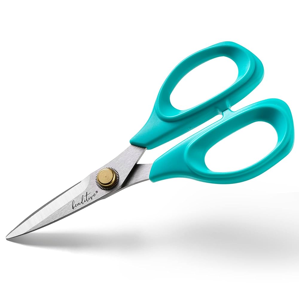 A pair of scissors with blue handle. 