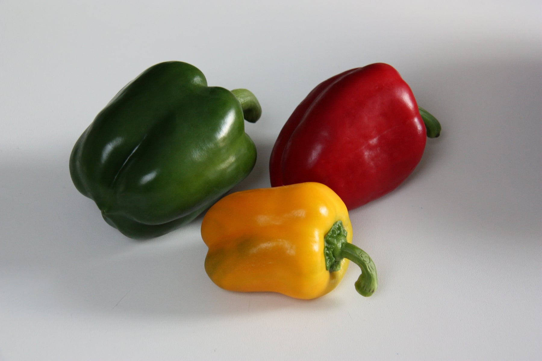 Green, yellow and red peppers.
