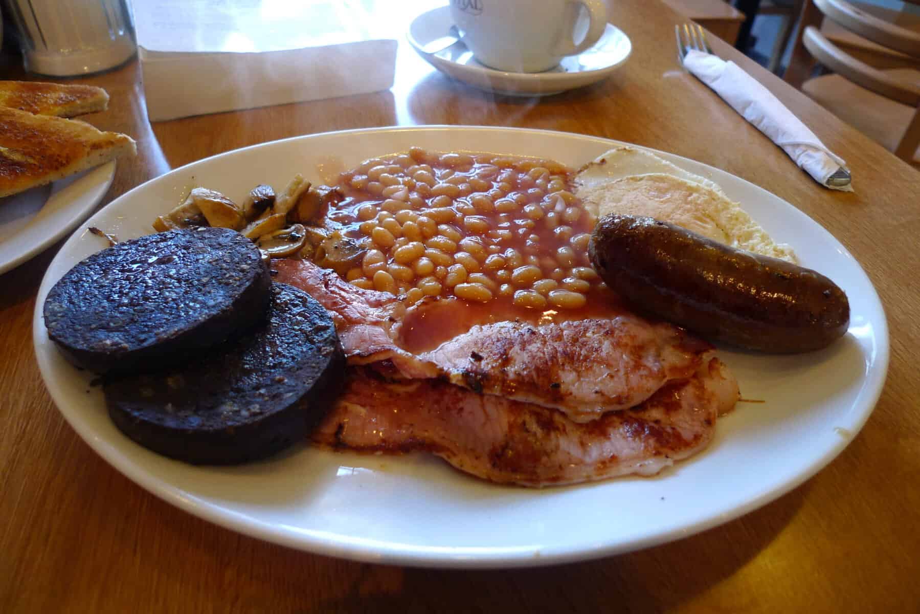 Black Pudding on a plate of breakfast foods.
