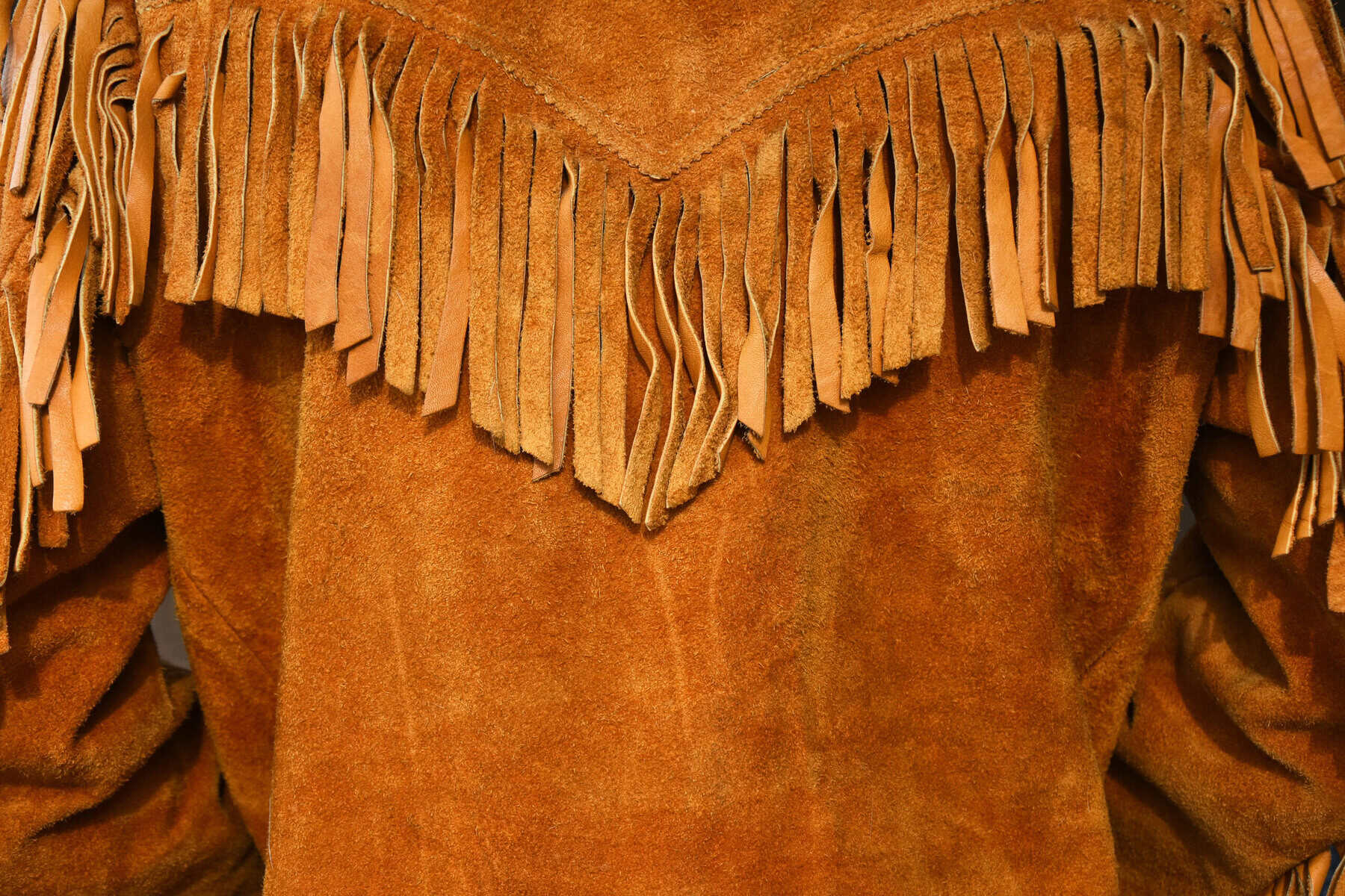 A brown fringed suede jacket.