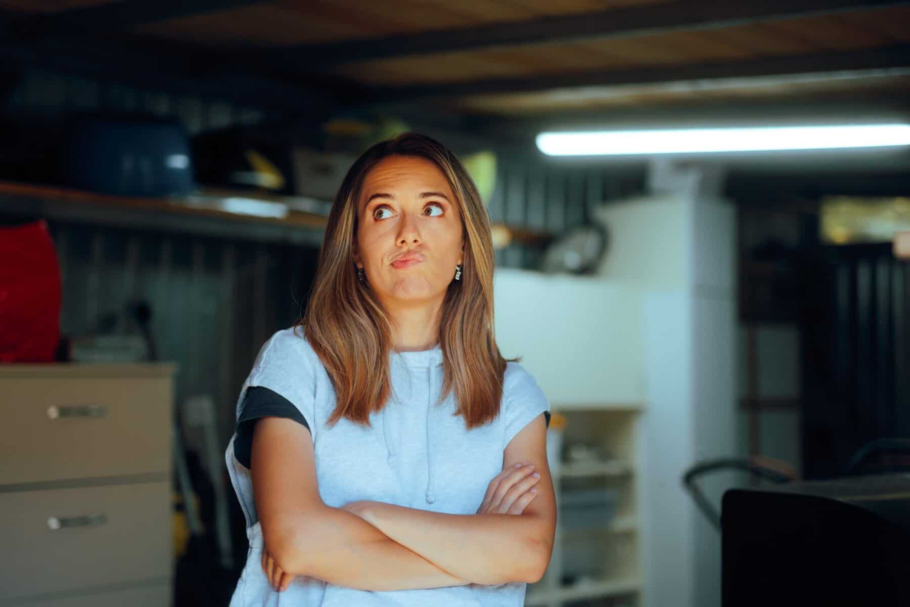 A woman tackling her messy garage.