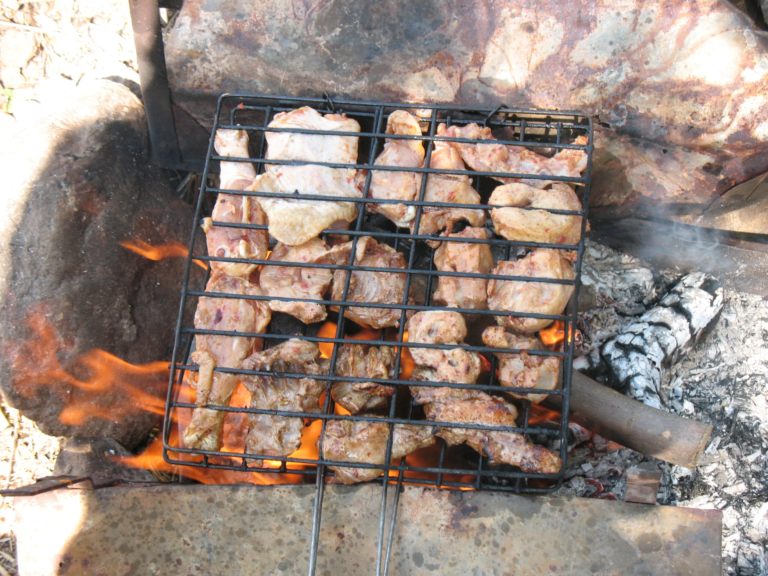 A BBQ grill with chicken.