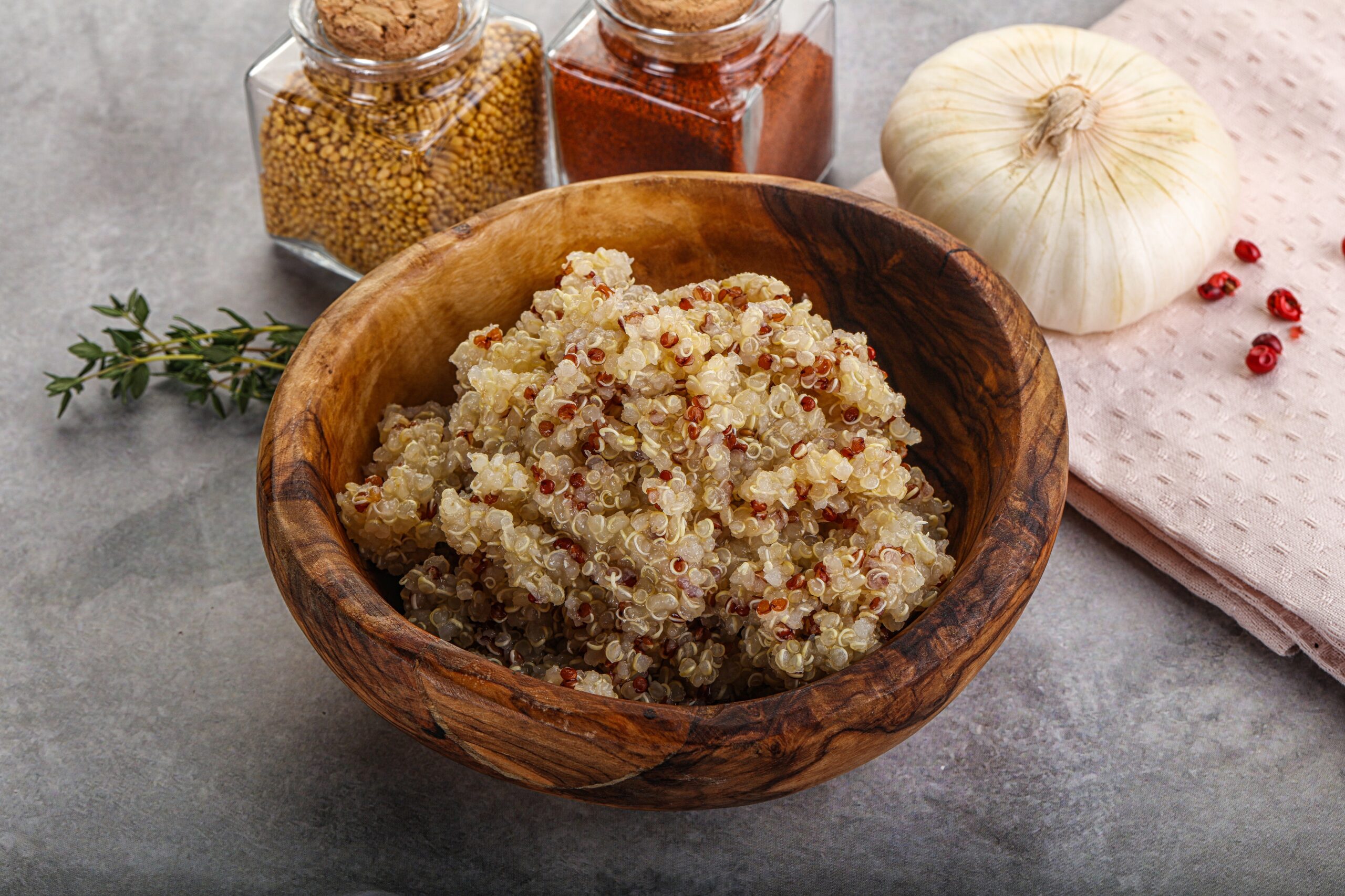 A bowl of cooked quinoa.