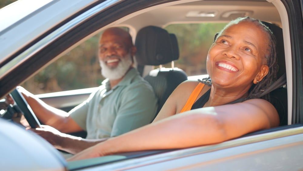 Senior couple driving.