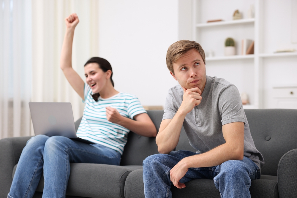 A man obviously jealous of the woman celebrating her success