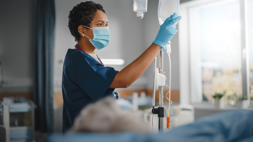 Hospital ward, Nurse attending to her patient.