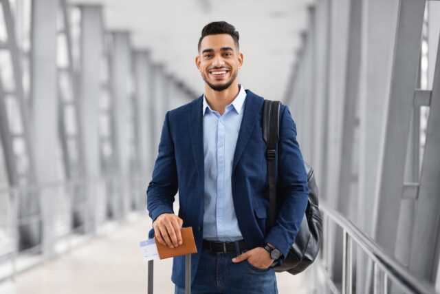 Young man at the airport waiting to travel.