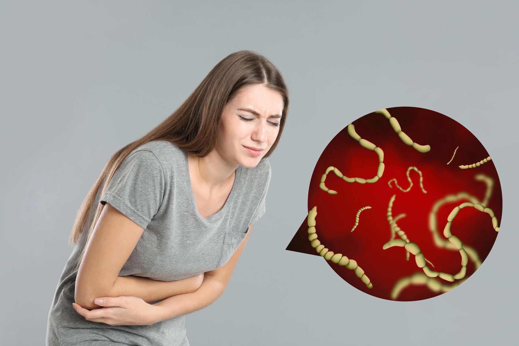 Parasites Under Microscope And Woman Suffering.