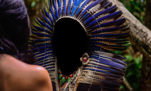 Indigenous ritual, blue headdress in the forest, Indian day, yanomami,