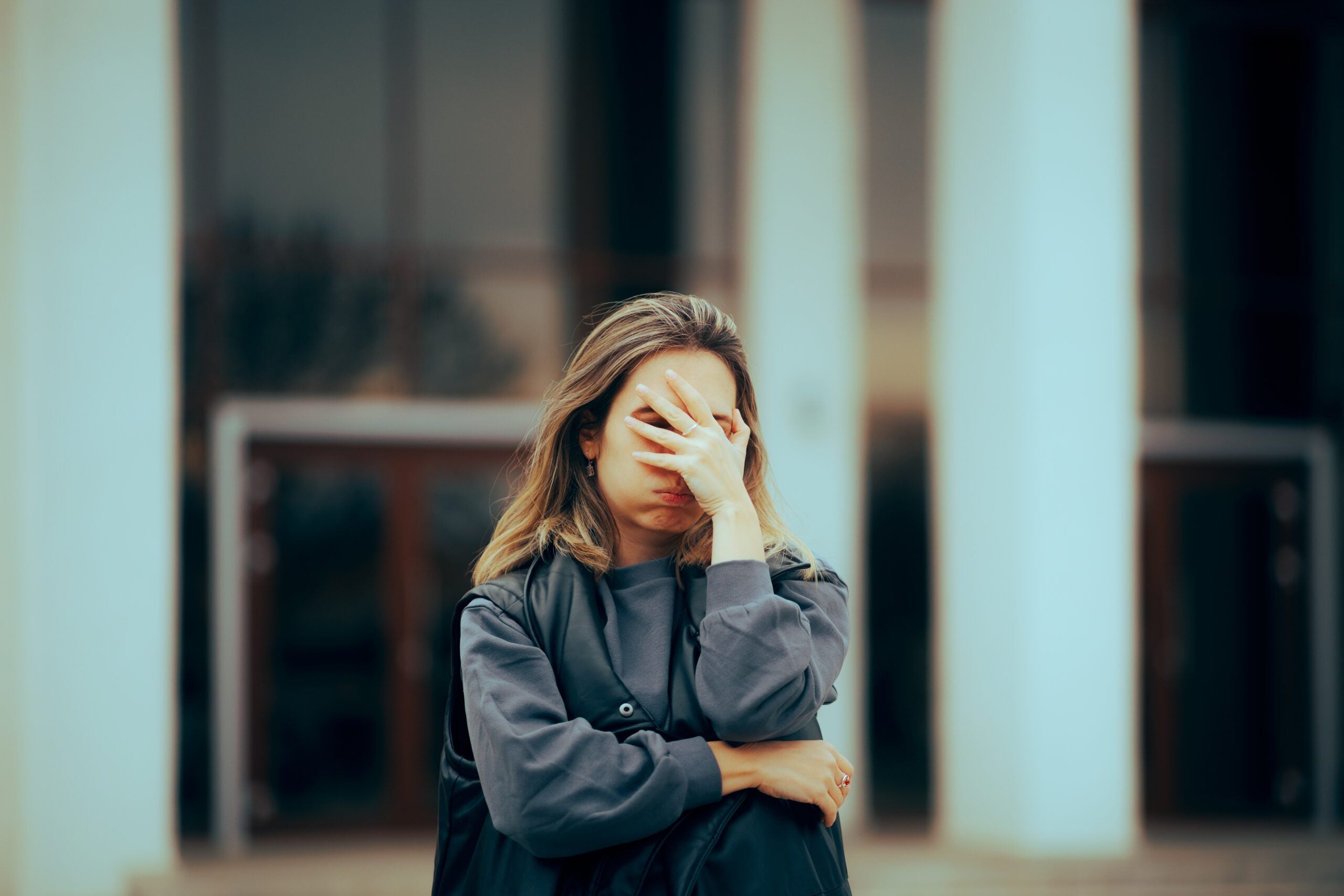 An unhappy young woman looking stressed