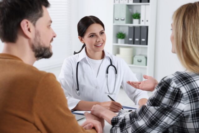 Couple having consultation with fertility Doctor.