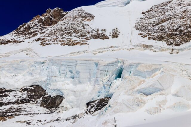 Permafrost melting on snowy mountain