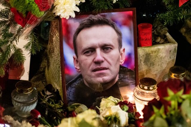 Flowers and candles laid at spontaneous memorial for Russian opposition leader Alexei Navalny,