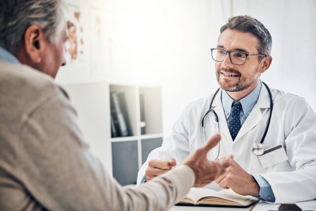 Elderly Man having consultation with his doctor.