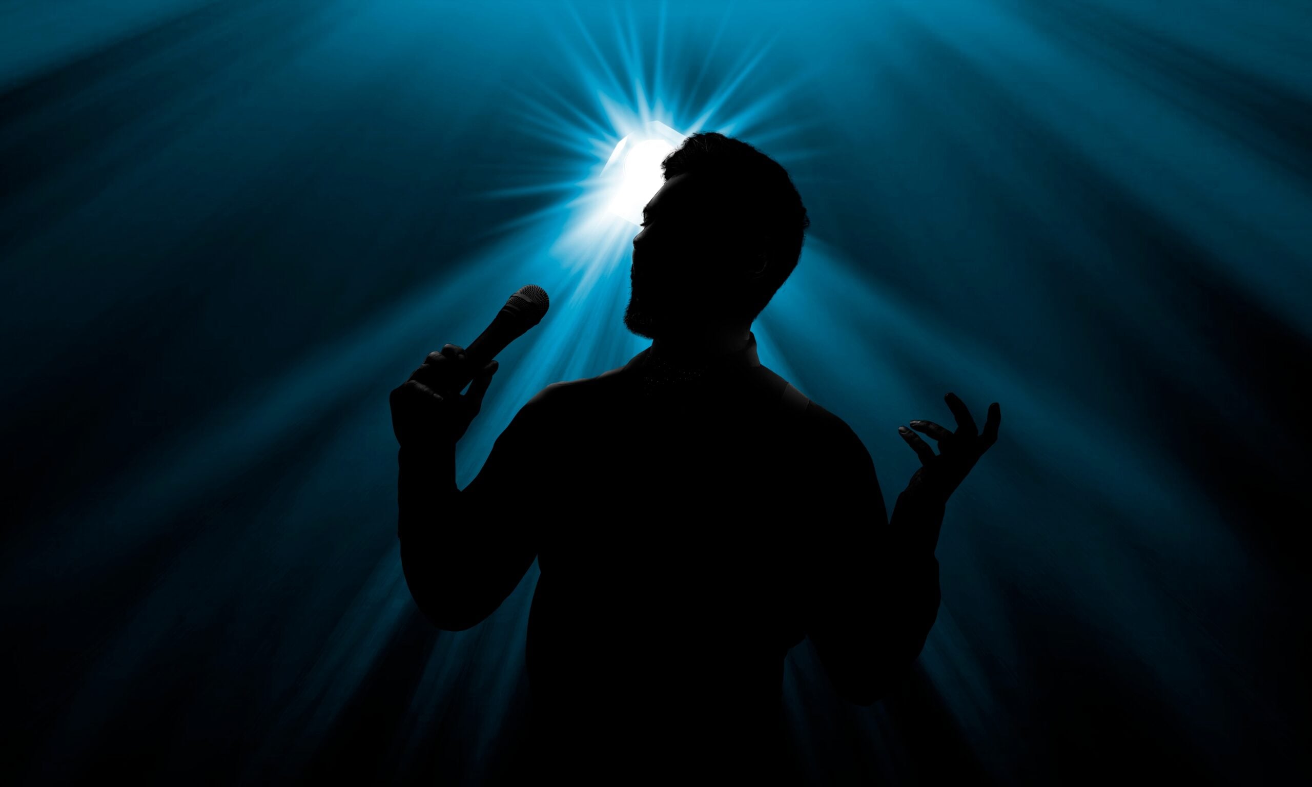 A male singer on stage. 