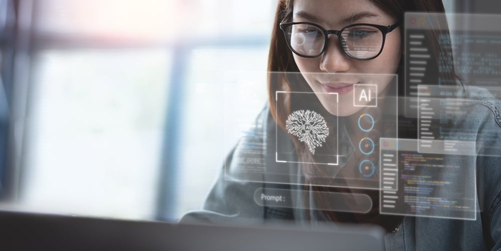 Woman looking at computer with AI technology. 