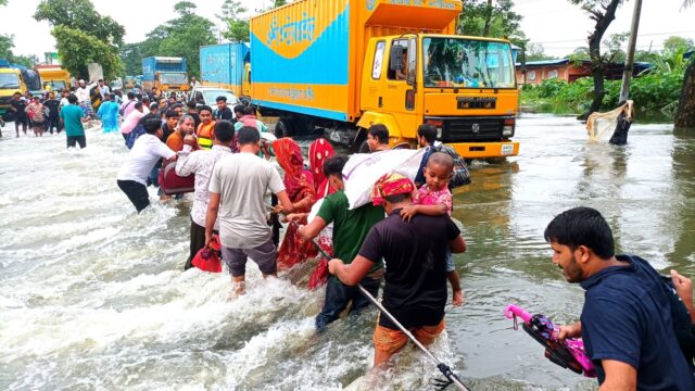 Floods Bangladesh, people relocating due to heavy rain.