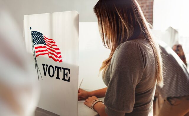 Woman at voting booth