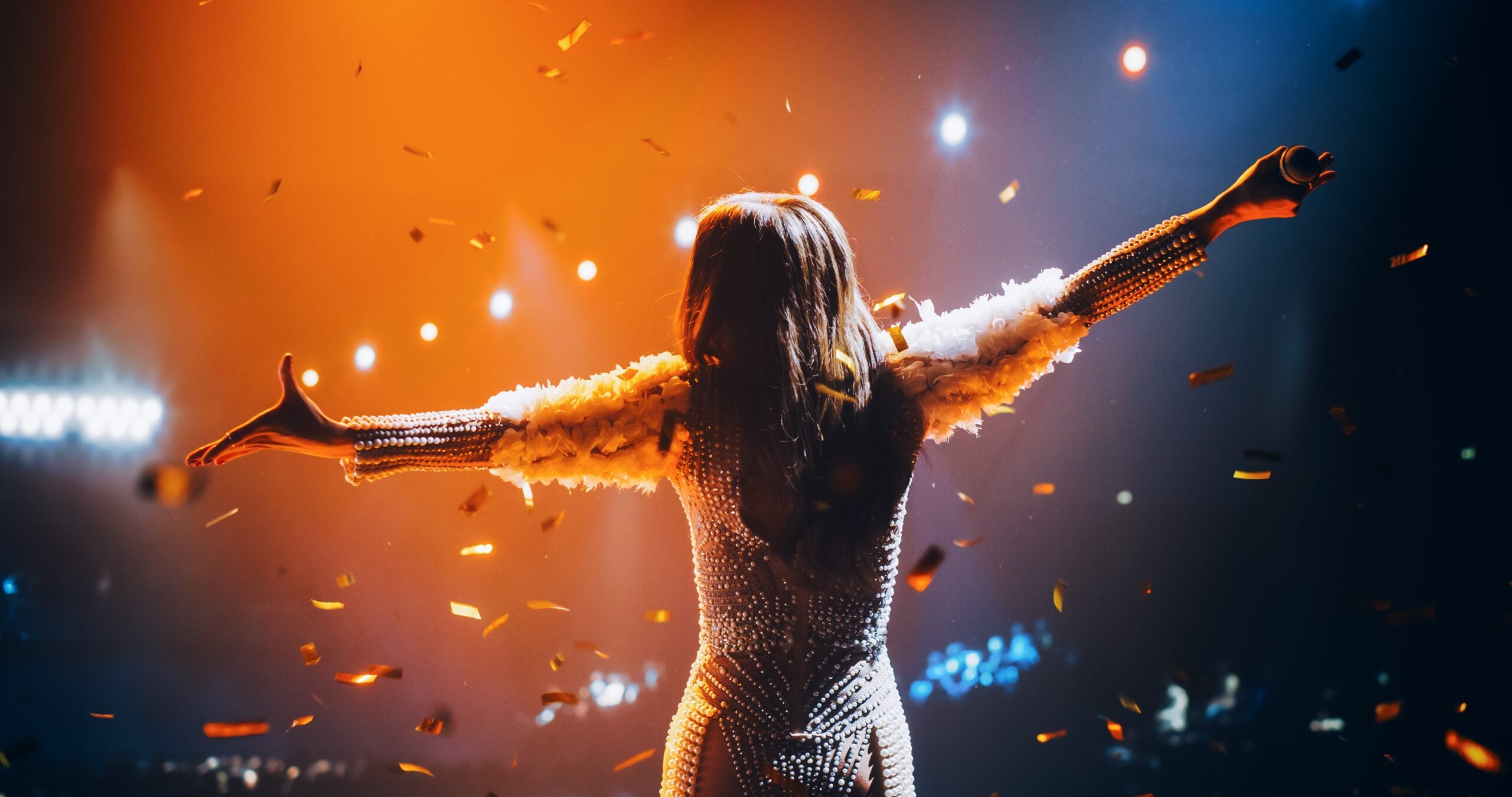 Female singing on stage.