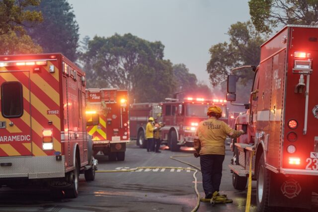 Pacific Palisades, fighter fighters battling flames.