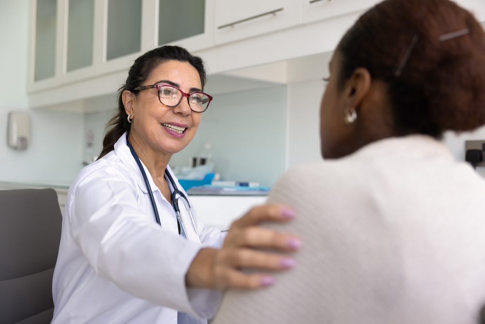 Female doctor talking to her female patient.