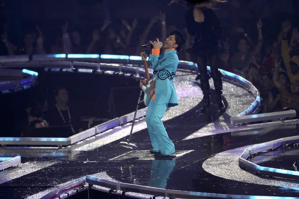 Singer Prince performs on stage.