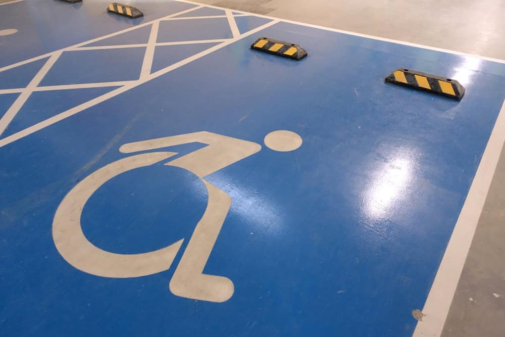 Parking sign for disabled and wheelchair users