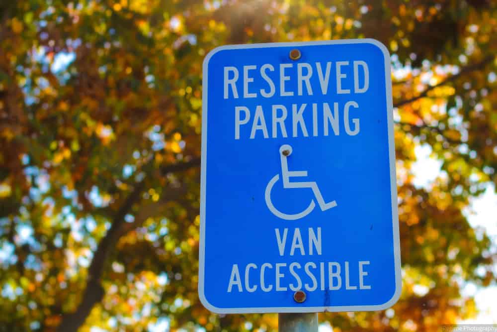 A reserved parking van accessible parking lot sign for wheelchair