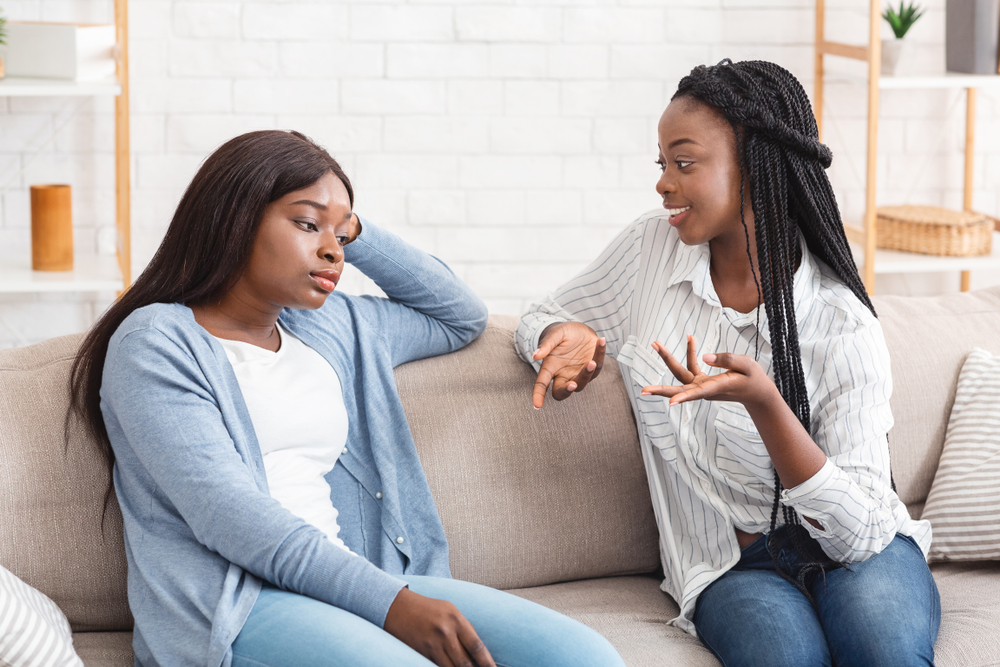 A woman tired of listening to her talkative friend