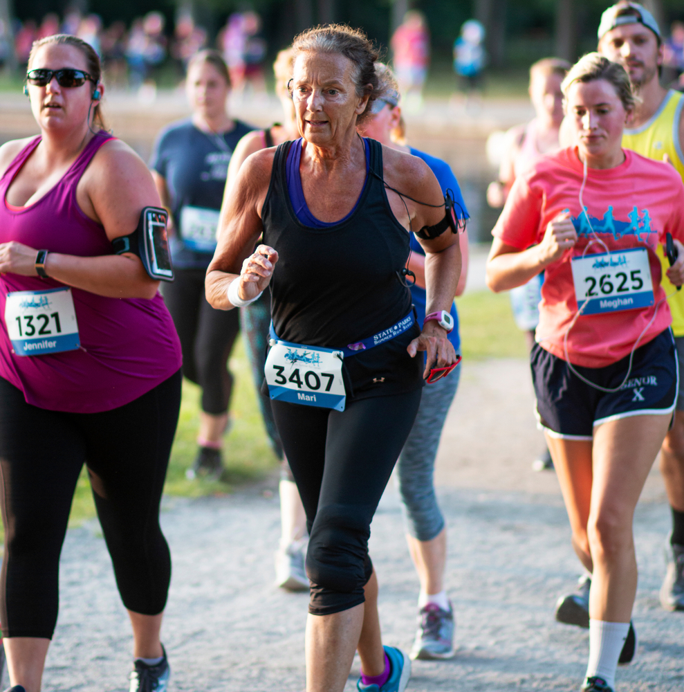 Middle aged women running a marathon