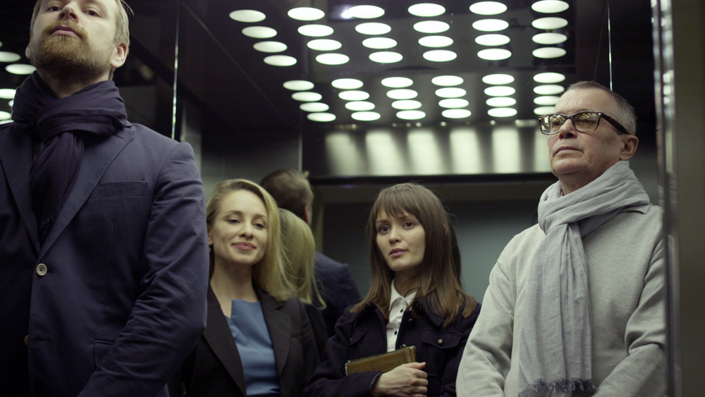 A group of business people in an elevator