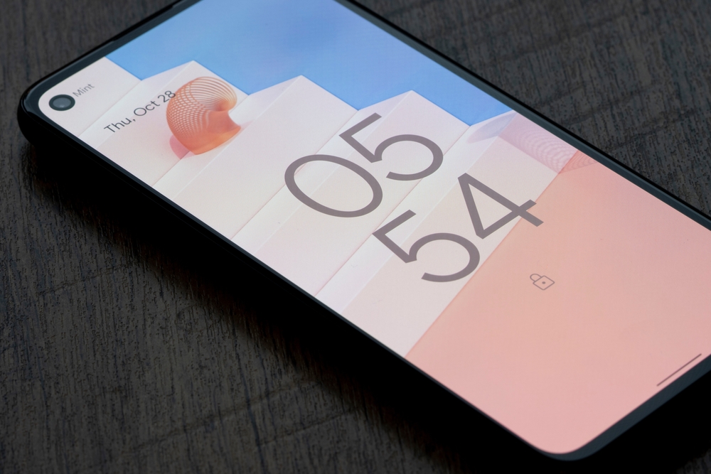 A locked phone screen showing the time