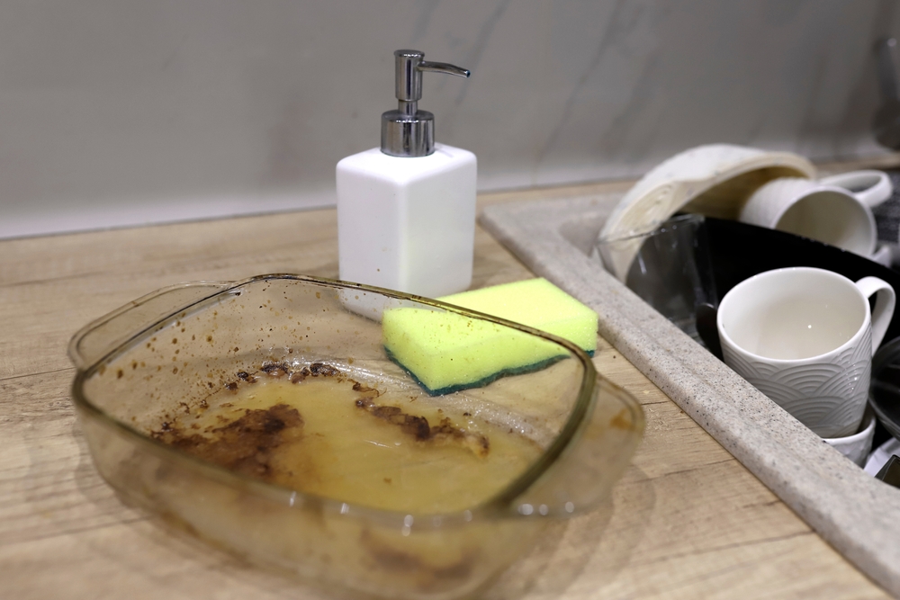 A dirty dish right next to the sink
