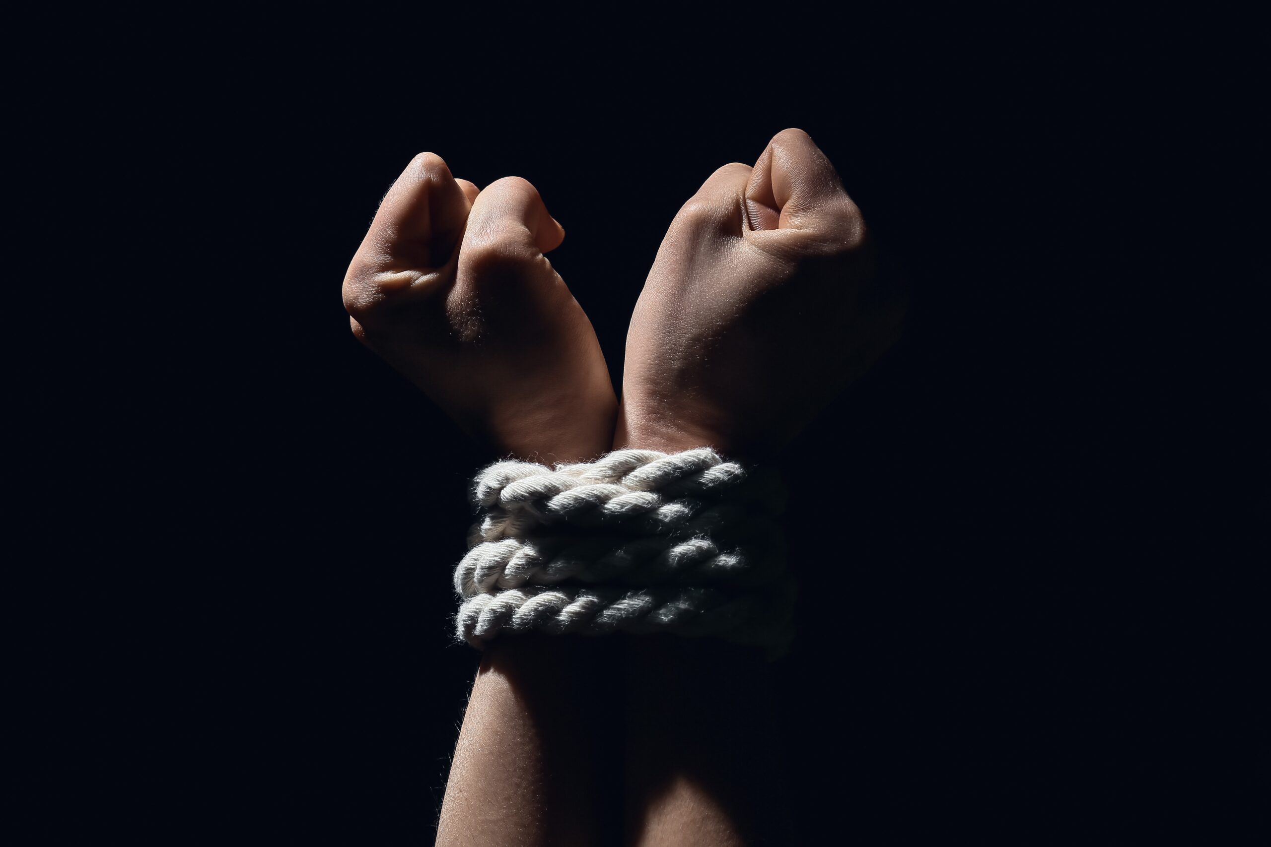 hands tied with rope kidnap crime