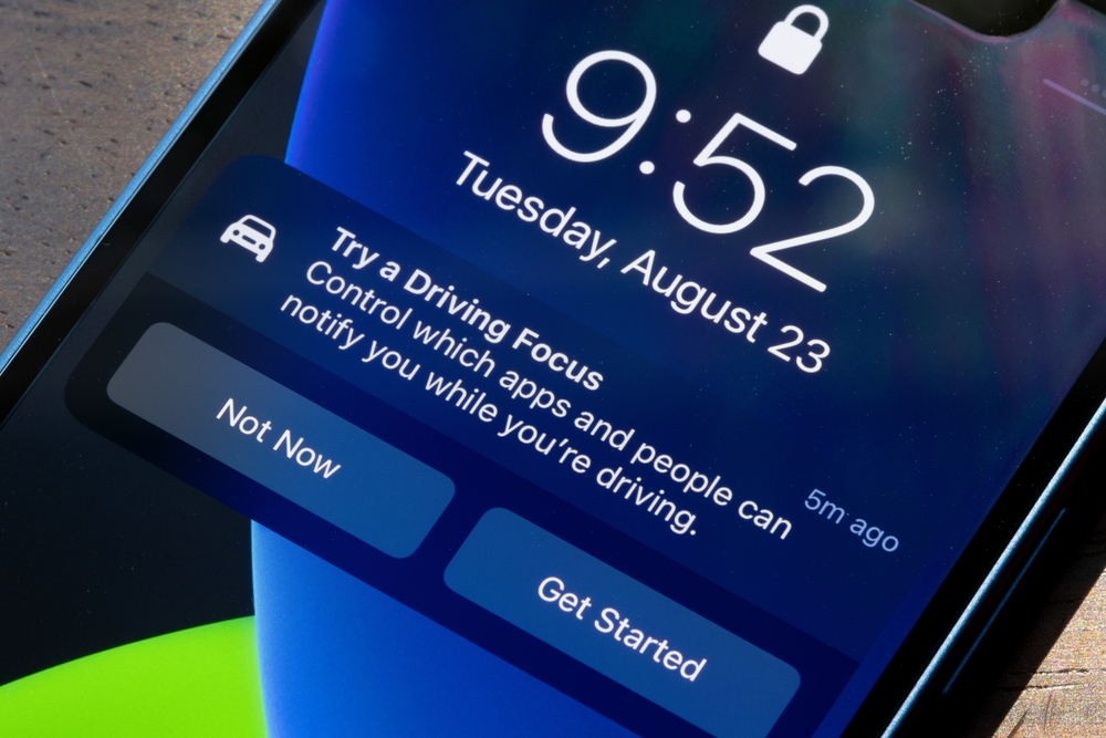A locked iPhone screen with a notification